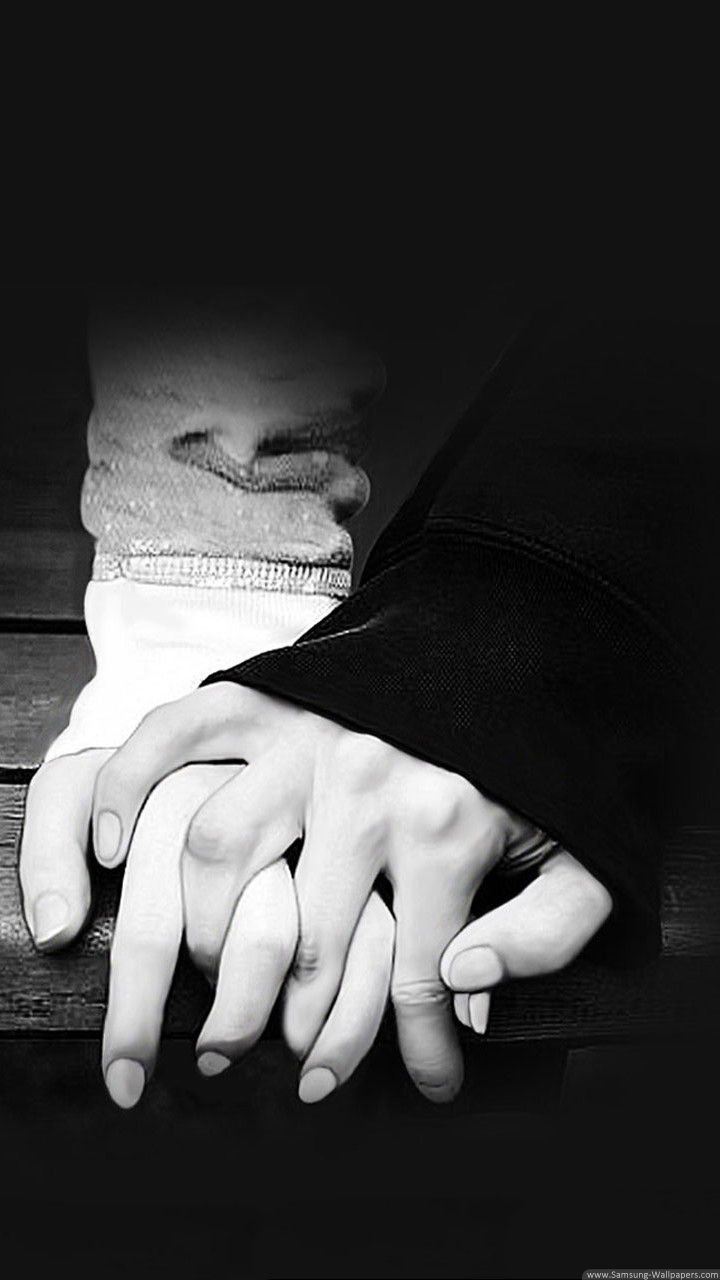 white and black couple holding hand