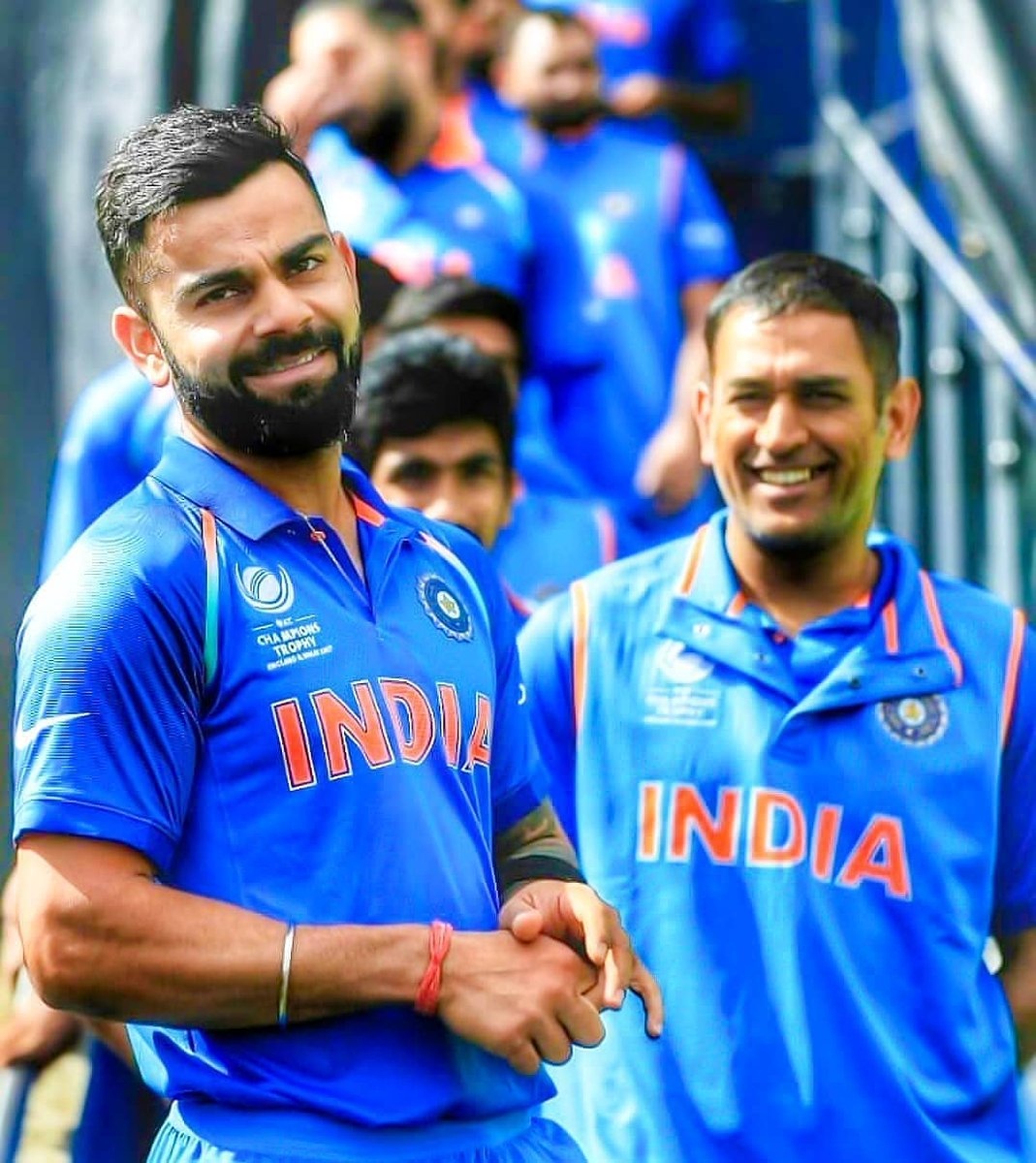 Dhoni And Virat Kohli Smiling in Blue Jersy