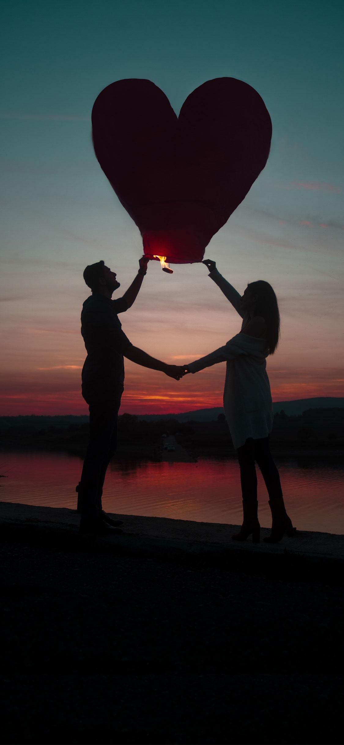 Romantic Couple With Heart Shaped Lantern